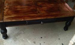Rustic Black Distressed Coffee Table with Oak Stained top. Has one drawer for storage.