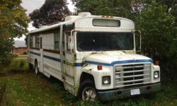 RV--- bus professionally converted to an RV. Includes: generator; 2 AC roof units ( used less than 10 times), propane tank (40" x 10"); 3 holding tanks (fresh water, grey water, waste); TV antenna; dinette-folds out to sleep 2; couch; fridge/freezer;