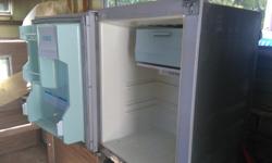 $100 for this rare little gem of a fridge .....it works great ....just needs a re-charge on the freon coolant....this fridge runs on propane or electric ....has a mirror front on it ....comes with all fridge racks as well.