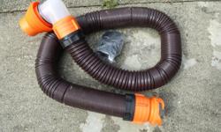 heavy duty rino flex rv sewer hose used 3 times as new extends to 14 feet