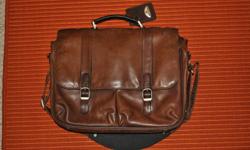 Genuine leather brown Samsonite briefcase, great condition, paid $300 originally. Looks better now than new. Two main compartments, includes padded insert for 15" laptop. Internal compartments with pouches for pens and cards. $100 obo. Glen 780-916-8098
