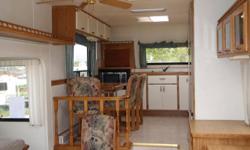 RARE FRONT KITCHEN MODEL
1 SLIDE
REAR WALK AROUND QUEEN BED W. STORAGE UNDER
DUCTED AIR AND HEAT
NEW FURNACE IN '09
NEW FLOORS IN '10
DELUXE INTERIOR
SKY LIGHT, BUILT IN VACUUM
HAS BEEN USED AS RENTAL UNIT
SACRIFICE SALE AT $6500.00
CAN INCLUDE LARGE DECK