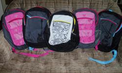 UPDATED: One pink backpack has been sold. This is a set of 4 brand new backpacks with 3 designs in total. Each backpack measures about 18" high and 14" wide, and comes complete with am attached pencil case. These backpacks have never been used, and would