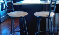 4 Counter height Swival Bar Stools, 28inch seat height, like new used 6 months, the seat cushions have no rips, no stains, dark mocha powder coated metal frames, and light mocha seat cushions, very clean like new, $30.00 each or $100.00 for all 4.