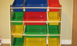 Shelf storage unit with colourful buckets to organize toys. Excellent condition from non-smoking home.