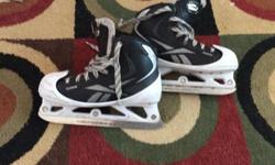 Size 3 reebok goalie skates with 1 year use. White and black