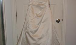 White wedding dress with train. Straps have been removed. Integrated crinoline and laced up back.