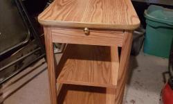 Small end table with a pull out. 13.5 wide, 22.5 long 20.5 high.