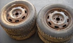 I have two radial magna grip snows P185/65R14 and two tiger paw uniroyal P185/65R14 snows all have 85% treads. They are on escort rims bolt pattern 4``