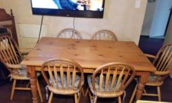 Hardwood Kitchen Table complete with 6 Oak Chairs and cushions. Excellent condition paid $1500 new. Asking $700 or best offer.