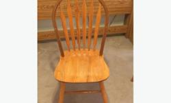 Solid oak dining chairs - 3 regular + 1 Captain's chair with arm rests. Moving. $140 obo