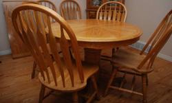 Solid Oak Dining Room Set with 6 matching chairs. Comes with one leaf. Table extends to 60 inches in length. Excellent condition. Was Asking $600.00 Now $450 or Best Offer. 1-705-840-2591