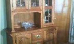 Solid oak diningroom set, table with hidden leaf, 6 solid oak chairs, hutch and buffet.