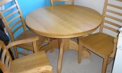 I have a custom solid oak set with table aprox 44" diameter 2 arm chairs and 2 regular chairs.The chairs are high back ladder chairs and the table has a centre pedestal. All is like new condition as I bought it and never ate at it. Every part is solid oak
