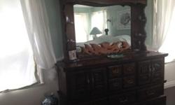 This Bedroom suite was made in California. It is solid pine and was formerly a waterbed. The name of this suite is Huntington Manor. This furniture is very heavy.
Dresser with Mirror Depth 19", Width 6', Height 74.5"
Dresser (Highboy) Depth 19", Width