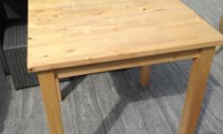 Solid pine table in excellent condition.