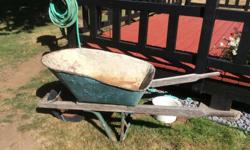 solid well built wheel barrow with wooden handles & metal frame, wheel is good but needs a bit more air, has been used for cement, some surface rust but no holes ... $50.00