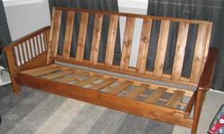 Solid wood Futon frame for sale. Frame is in very good condition and is in need of only a mattress.