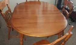 solid wood table and 4 chairs with 2 leaflets good condition. $75 obo