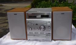 This SONY CMT-CP300 system contains a Receiver/Tuner (Model HCD CP300); a 2 Cassette Tape Deck (with auto reverse); and a 3 CD changer component and it also comes with a two-speaker system (Model SS-CCP300). A remote control is also included. This is a