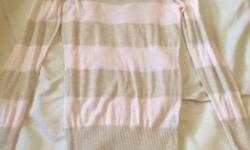 I have a long sleeved sweater with a pale pink and pale gold (with faint sparkle) stripe pattern. Has circular opening and bow at back (see pics). Never worn. Asking $5.