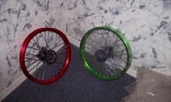 Spoked Rims. 15" Diameter (measured from outer rim edges). Have Inner and Outer Bearings. (Never used or mounted). Excellent condition. Green and Red Pair for $65, or individually for $40.