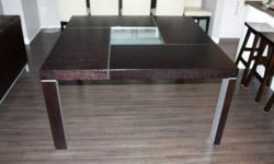 Very nice, high quality 5x5 square dining room table. The table is very durable dark hardwood finish and it is in immaculate condition. It was purchased at Scan Design about 6 years ago.  The table has been stored for 4 of the last 6 years.
 
It seats 6