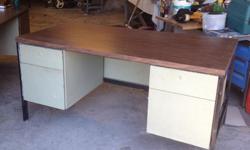 Large commercial desk, 4 drawers all working on roller bearings. approximate top dimensions 30" x 60". Heavy, bring help to pick up in a pickup or van.