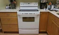 One year old Frigidaire ceramic flat top stove with hood fan. In perfect working condition.