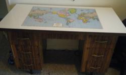 I am selling  a student desk. It was the very first I think I bought when I came to Canada in 1988 (23 years ago). You just wont find these anymore. In excellent shape. It has a world map from way back. Still has the USSR, Checkoslovakia, Yugoslavia and