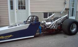 1996 rear engined dragster...454,2 speed glide......comes turn key or sell/trade rolling..needs a tach, replace fuel lines to carb with braided lines and someone with the urge to go fast. Has ford 9 inch (chromed) with 4;56 gears in the rear, wheelie bar,