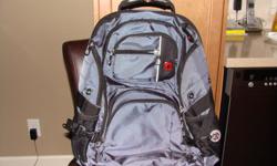 Like new Swiss army backpack. Charcoal grey and black. 19 inches x 16 inches. Reinforced carry handle as well as padded over the shoulders straps. Separate zippered padded laptop compartment along with another zippered compartment. Numerous other