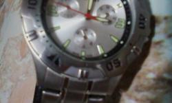Model 59917, Displays-day,date and month. Water Resistant 100M. Glow in the dark digits. Like new, still has protector plastic on face, worn a couple times. Brand new battery, proffesionally installed.