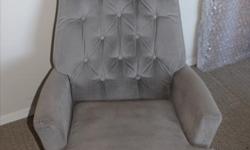 Grey upholstered swivel chair. No rips or stains in very good condition. Downsizing.