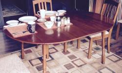 Solid maple table and 4 chairs. Fully extended with three leaves the table is 78 inches long. Without the extensions it is 48 inches long. Each leaf is 10 inches wide. The end "wings" also fold down and they are about 12 inches wide. The chairs are also