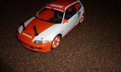 This is a kit that I completed last Christmas. It is front wheel drive and has a large following in racing. The Car comes with stock Johnson motor and a futaba servo. You will need to supply the balance of the electronics (charger, batteries, remote,