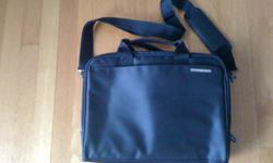 Black Targus lightweight zip-down laptop bag. Mint condition. Two separators inside with secured padding area for laptop or iPad, also has front pocket with pen loops and PDA space and additional Velcro back pocket. Dimensions: 37 cm (long), 27cm (high)
