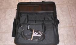 New, never used - targus loptop carrying case. Comes with kensington lock and key. Targus Notebook Security. Holds laptop 14 x 12