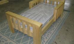 Rustic looking toddler bed (new) with clear coat finish.  If you need a matress I have one for an extra $10 (used).  Nice Christmas gift!  Would look real good in that cabin of yours by the lake.  It's built for those exceptionally rough and tough cute
