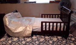 Hard wood toddler bed c/w mattress and mattress cover. All in excellent condition. No stains or tears. Pick up only please