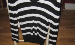 Never worn, Black and white striped Tommy Hilfiger V-neck sweater. $30.00