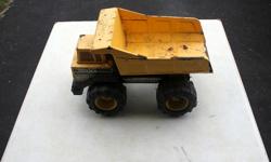 For sale is a Tonka metal dump truck. A little rusty as shown in the picture.