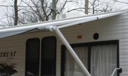 21 foot trailer awning for sale. brand new from a 2011 trailer only opened twice.
No longer required as I put a roof over my deck. Comes complete
and also has center post with ground support.