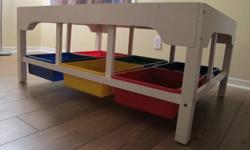 Train table with plastic containers under it for toy storage. Is also great for other play like blocks or cars.