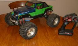 Traxxas E-Maxx, 2.4 ghz radio with traxxas link, titan 550 dual motors, 16.8v EVX-2 esc, dual steering servos, fully waterproof, works excellent. also comes with extra body & tires.
$275
send me an email,  mailto:trevornolin@hotmail.com