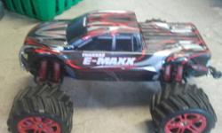 For Sale is my Traxxas E-maxx! model 3903.. Great condition, needs nothing! It has many upgrades such as, headlights/tail lights, alluminum bulkheads, all rpm skidplates, wheelie bar... also has some spare parts! completely waterproof... comes with