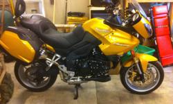 Triumph Tiger 1050 *New Corbin seat with pillion backrest *Triumph panniers with inner bags. *New Michelin Pilort road 2 tires * 20k service just completed at Motorad performance *heated grips *center stand *adjustable suspension. *I can store the bike