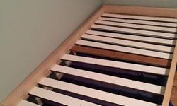 Twin Size Bed made of pine. We used left over wood for the slats, that are adjustable.
