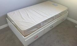 White twin size bed with 3 drawers beneath for storage. Mattress included. Email for additional info.
