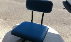Seat with a fold up back. Clamp on style.